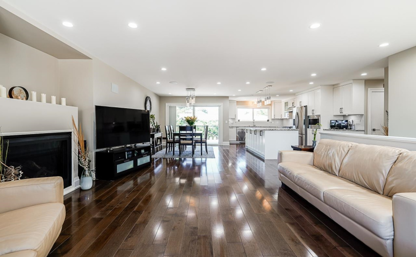 Beautiful open layout, custom details throughout including bevelled edge high baseboards & wide window casings.