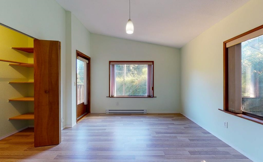 With door to deck as well as stairs to front yard.