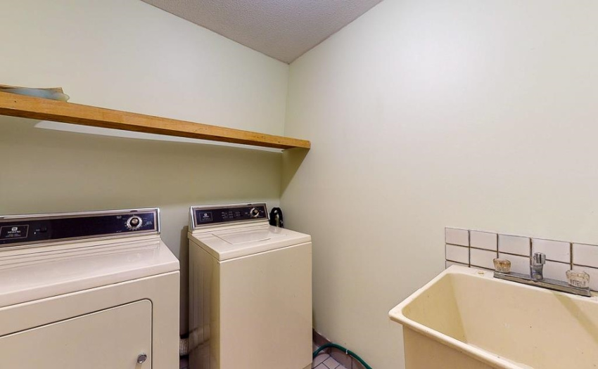 With laundry sink - Hot water tank only 1 year old!