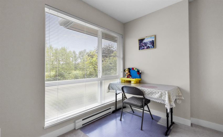 Thir bedroom on the lower floor, facing south to the green space