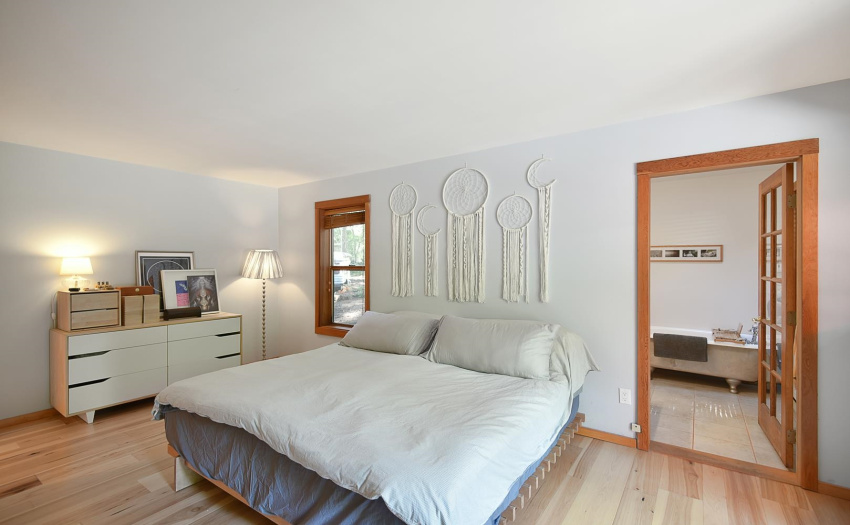 The master bedroom boasts an ensuite with clawfoot tub and semi walk in closets