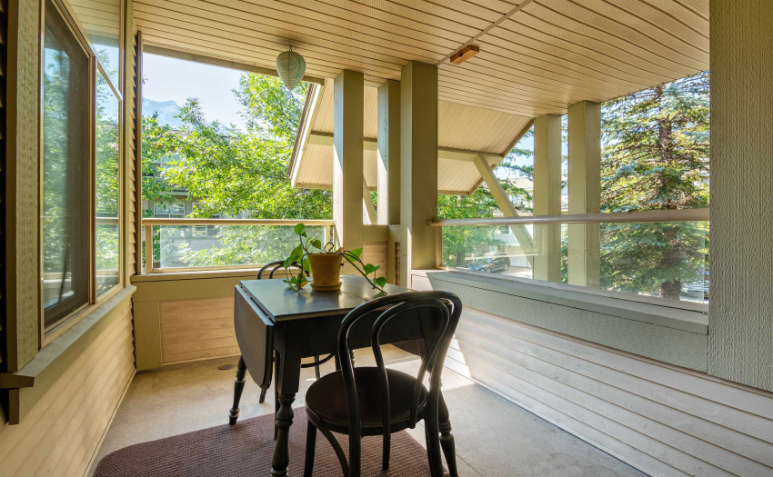Covered balcony for year round barbecues or a cozy reading space.