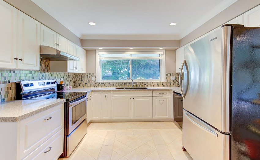 With a window to let the fresh air in, and high quality window blinds this new modern kitchen is high quality and will make you proud when friends drop by. Like NEW Appliances,.  Bosch Dishwasher, High Power Exhaust Fan, and Frigidaire Fridge!