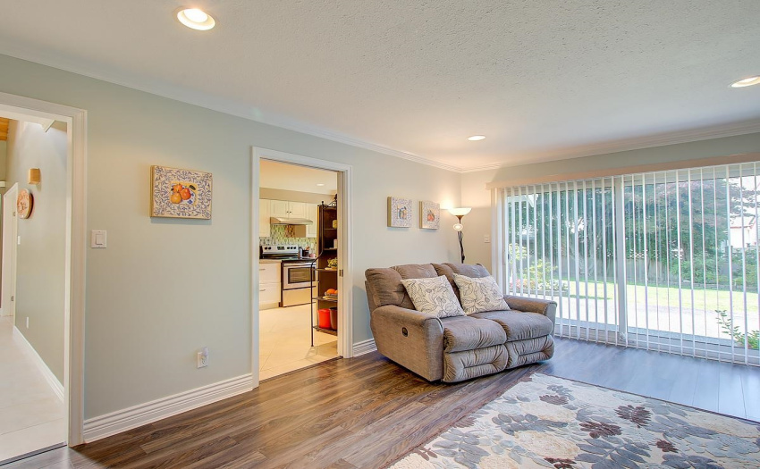 This family room is just that a place where family and friends gather, laugh and enjoy each others company!  Perfect place for a loveseat!
