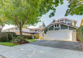 With a low maintenance front lawn, there is a touch of class about this home. See how the tree w island on the left blends in with the manicured lawn in a way that welcomes you home! The two car garage has plenty of room for storage and a new window.