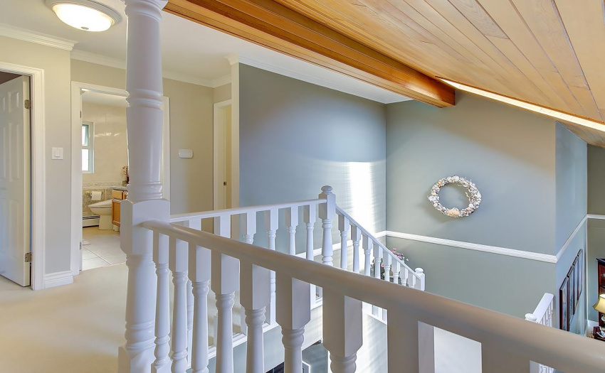 Beautifully Painted White Staircase that contrasts tastefully with the hardwood Ceiling and Skylight. Extra thick White Carpeting on 2nd Floor, Baseboard Heating in Upper Bedrooms and Bathrooms.