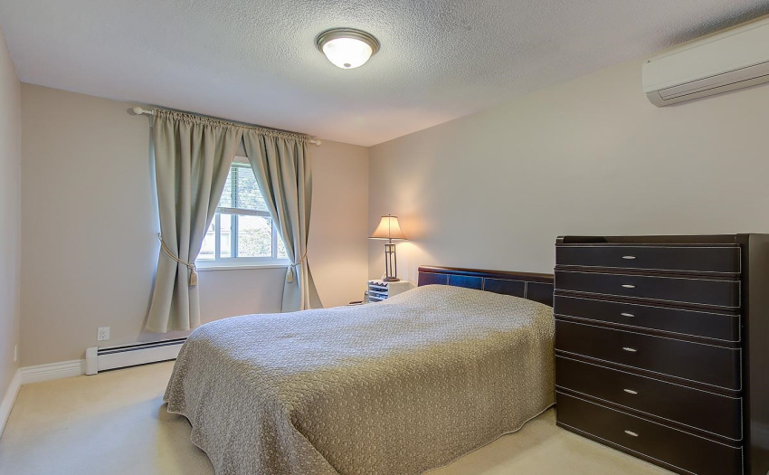 With baseboard heating and an air conditioning unit that can stabilize the air temperature in two of the bedrooms upstairs. The Daikin Air Conditioning unit keeps this bedroom temperate and so comfortable.
