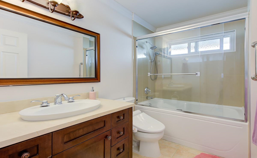With an extra long mirror, quality cabinets, and baseboard heating, this Private Master Bathroom is as pretty as the photo looks!