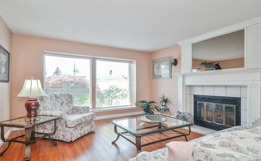 Open, bright living room. Cozy gas fireplace for those cooler evening.