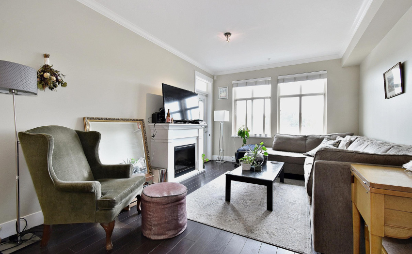 Spacious living area with bright large windows