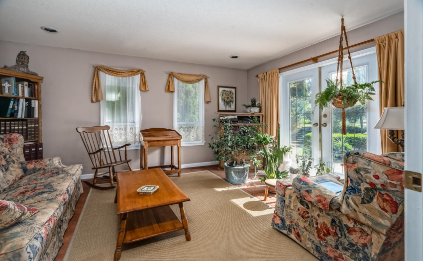 Right off the kitchen is the den/family room - a great place for the kids to hangout. It has access to the back patio through french doors.