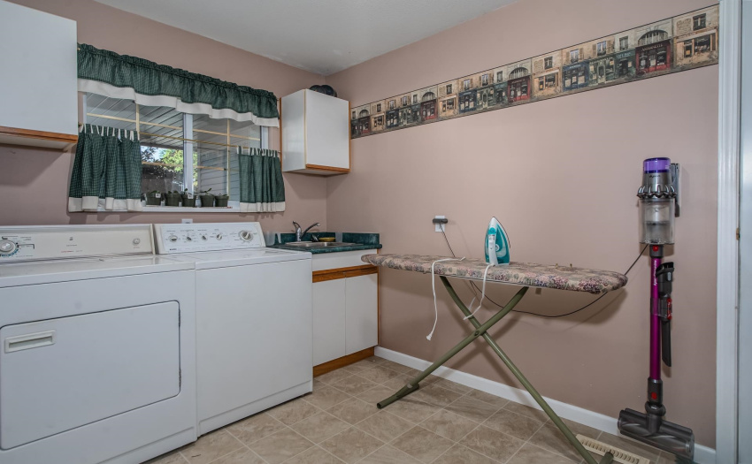 Located off of the garage access next to the foyer makes this large laundry/mud room a fantastic place to drop your stuff when coming home.