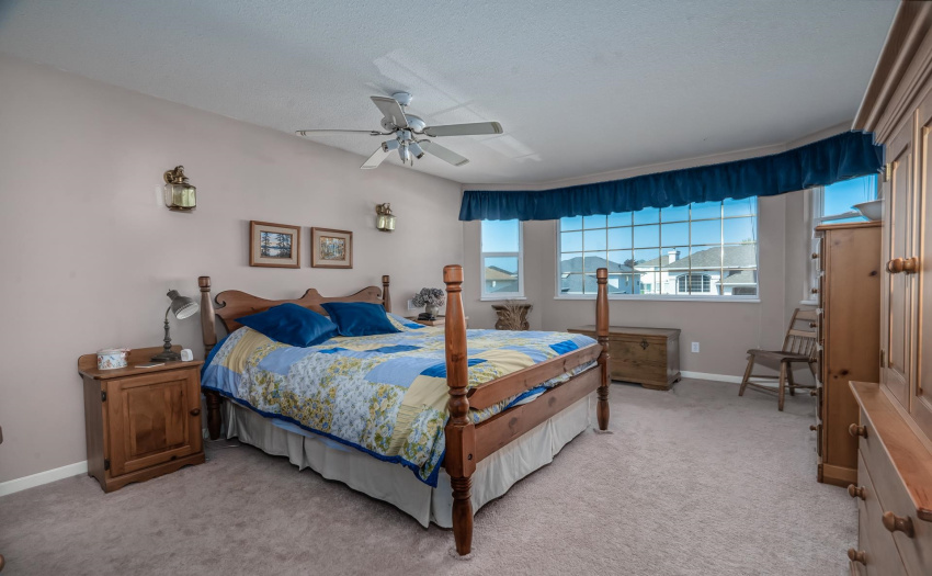 This large private suite is at one end of the hallway. It features a wall-to-wall bay window. It offers lots of space for a king-size bed and a few dressers.