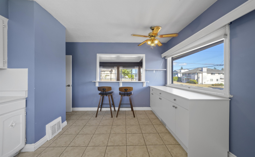 Main floor kitchen with pass through to living room.