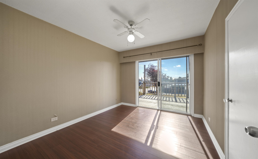 Main floor bedroom #3 with access to outdoor deck