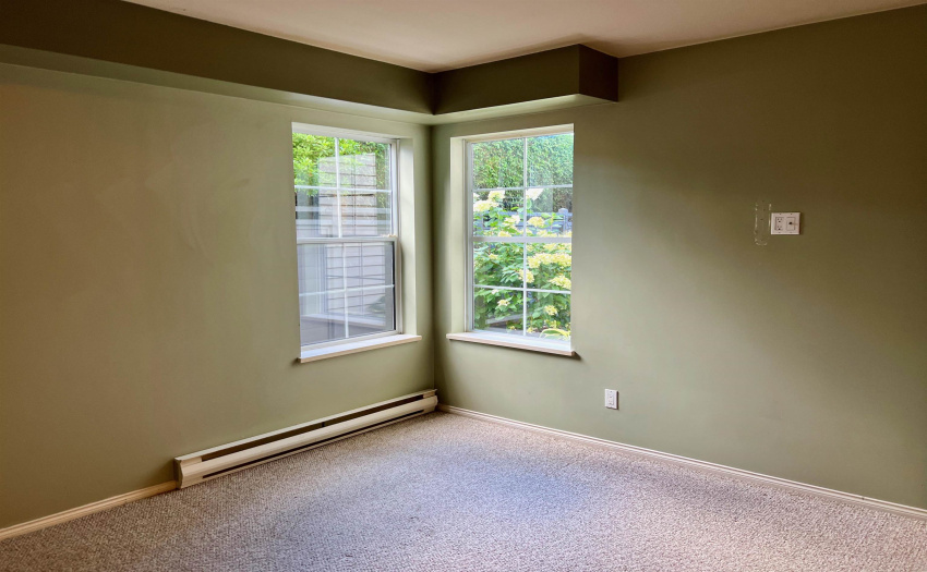 Windows look out onto garden patio