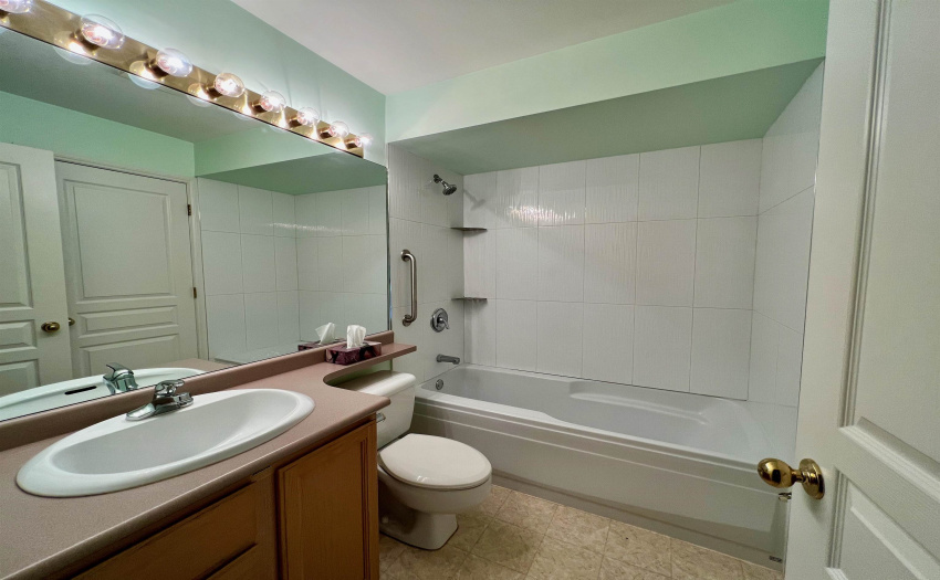 With full tiled tub and shower