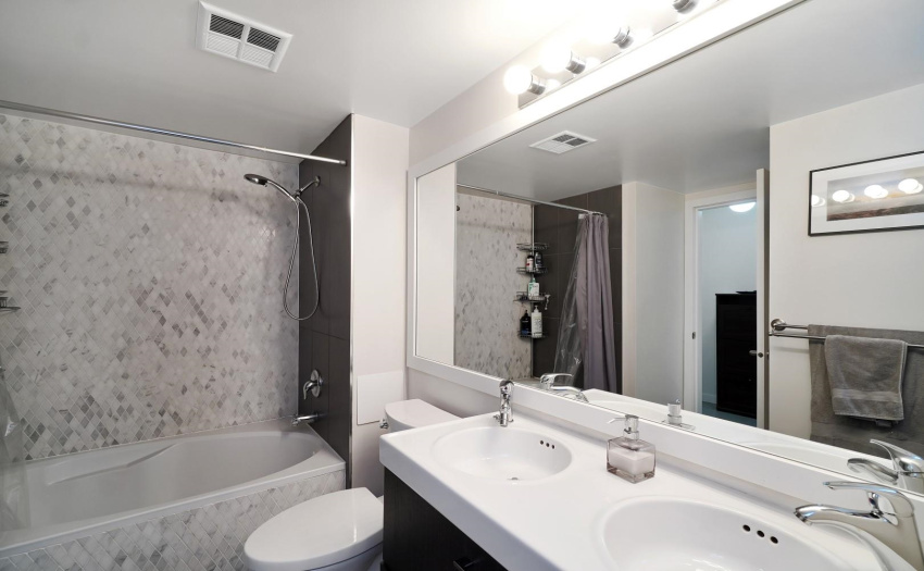En-suite bathroom with Shower+ soaker tub, with double sink & linen closet.