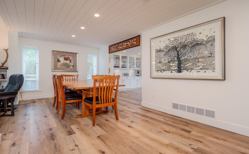 Fit a long table here for those extra special meals and events in your life!  This home has flow. (Carving over entrance to kitchen not included).