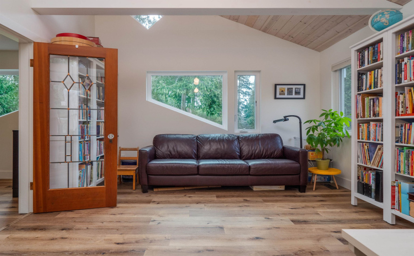 View to the front of this fabulous room.  Vaulted ceilings, vintage doors and interesting window design make this room a true escape for writers, artists or thinkers!  If you have children this could be a great playroom!