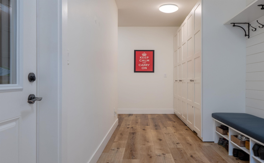 Great access through this mud room with more storage for shoes and coats.  Leave it all here!  Door to the left accesses a large 