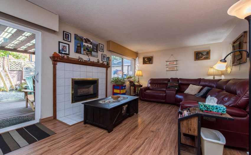 Living Room with Sliding Glass door to Covered Deck and back yard