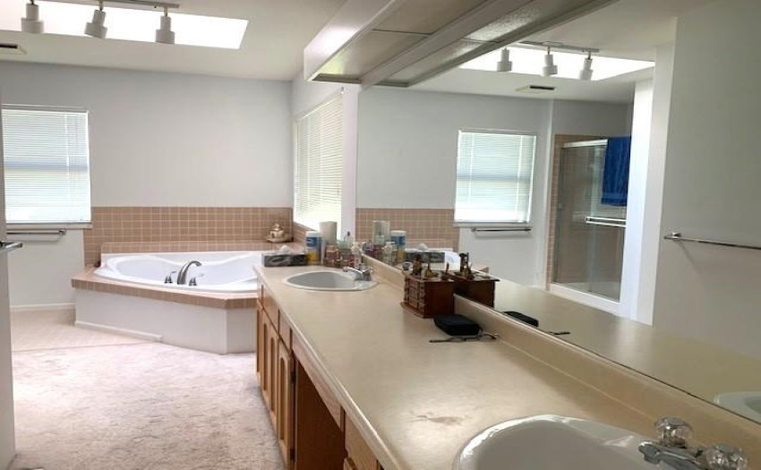 luxury bathroom with soaker tub and shower