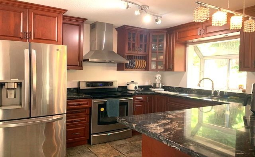 updated with granite counters and cabinets