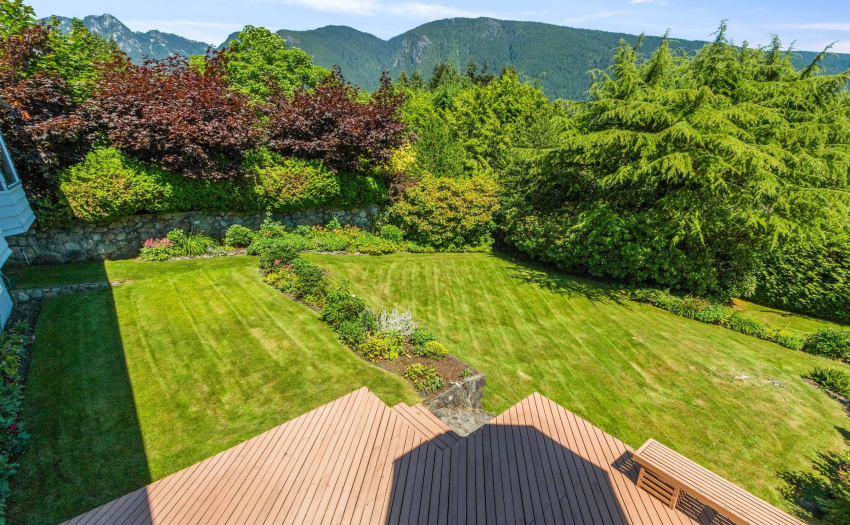 View of expansive back hard off of downstairs deck area