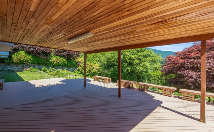 Large covered deck area off lower level with walkout to lovely backyard