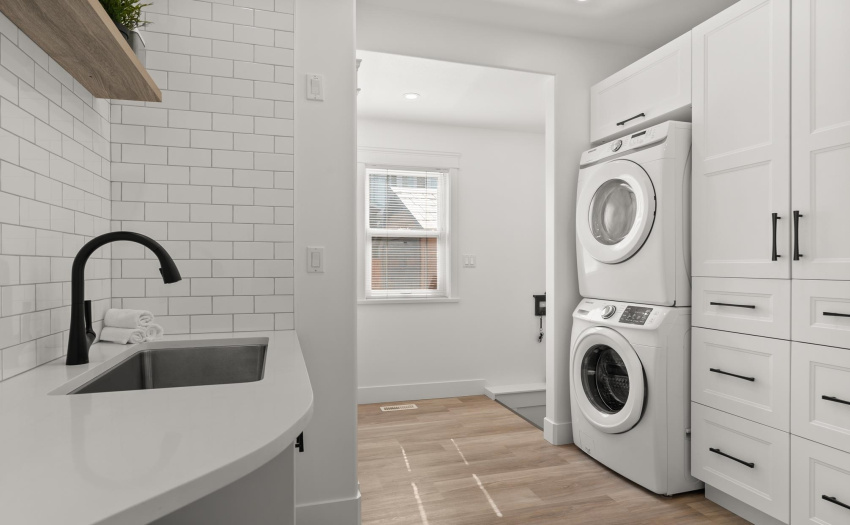 Newly renovated custom laundry room with drawers + interior drawers for extra storage.