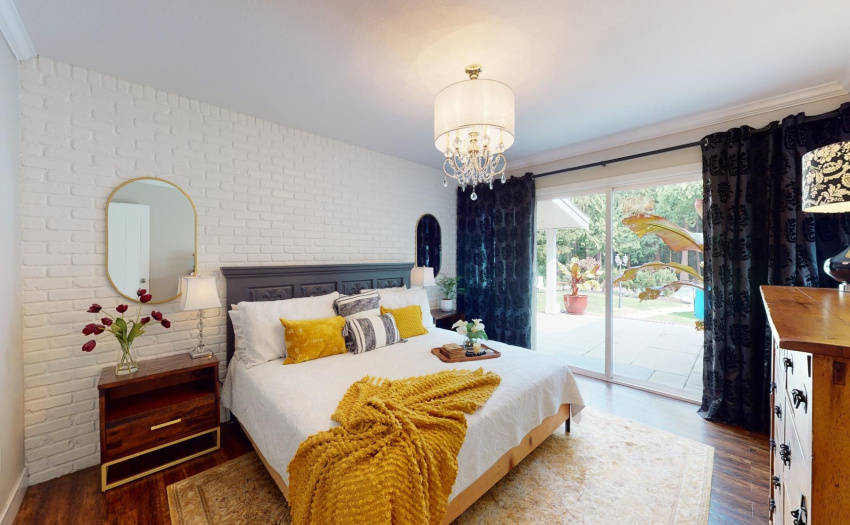 Gorgeous Master Bedroom with Brick Wall backdrop. Features incl...access to deck with double slider, massive walk-in closet, and stunning Bathroom!