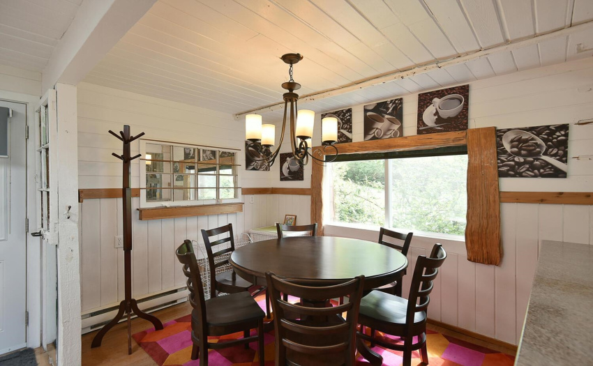 Woods details, blinds on every window, sunshine and views - a home with character.
