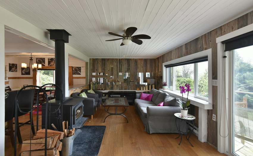 Spacious for this compact square footage - wood stove sits in the middle of this area and provides warmth on those winter days.