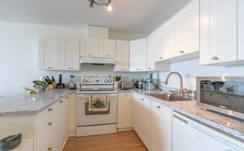 new quartz countertop and faucet. Kitchen cupboards all updated.